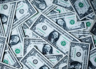 Report: Colorado Business Leaders Remain Pessimistic About Economy One dollar bills are strewn about.