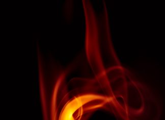 Expert Advice on Wildfire Law An orange flame with a black background.