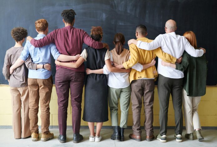 A group of people standing indoors.