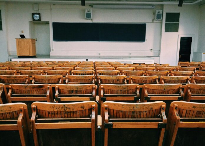 rows of empty seats in front of a lectern.