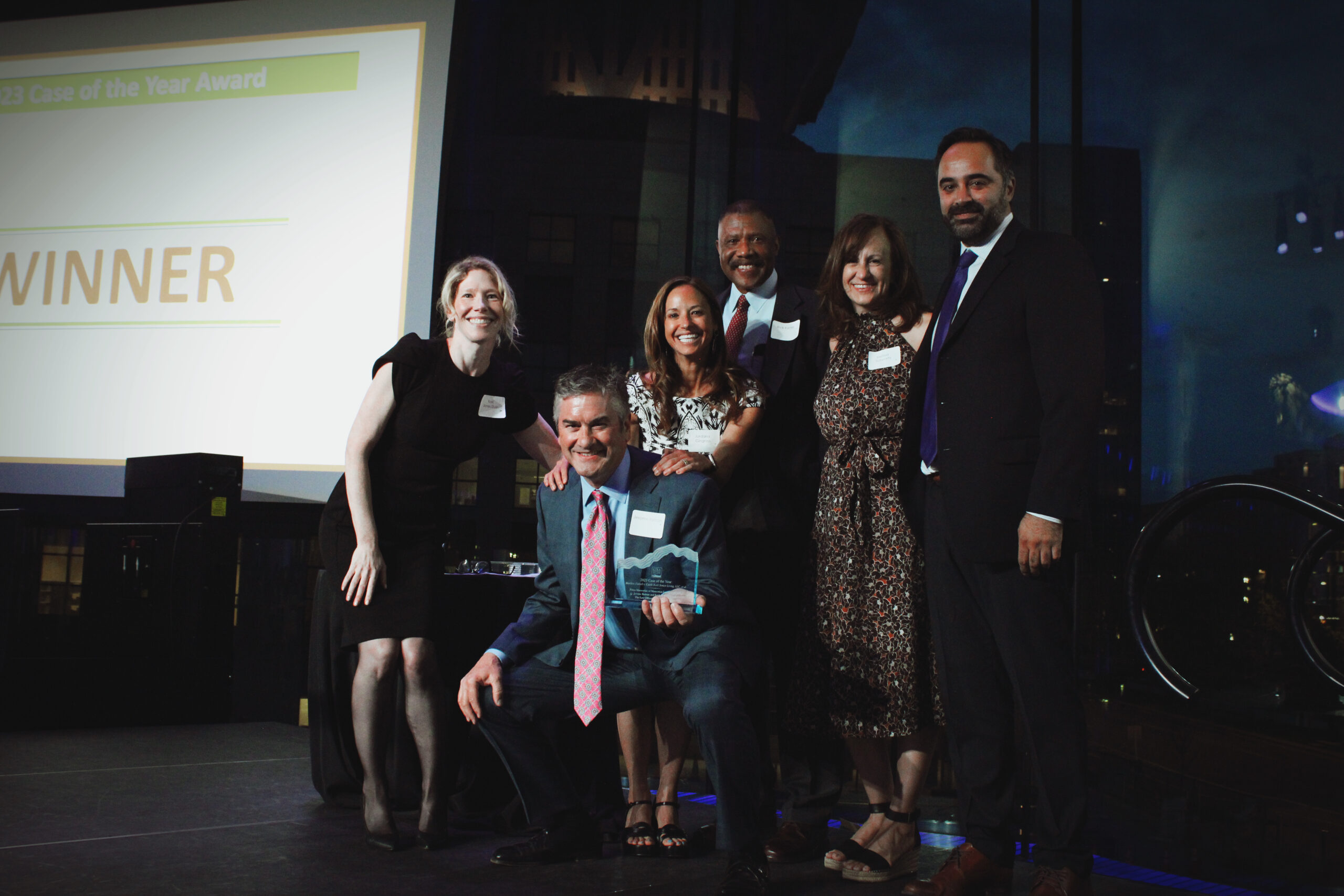 Porya Mansorian, Jerome Reinan, Jordana Gingrass, Matthew Farrell's father and CTLA President Kari Jones Dunlin pose with the Case of the Year Award.