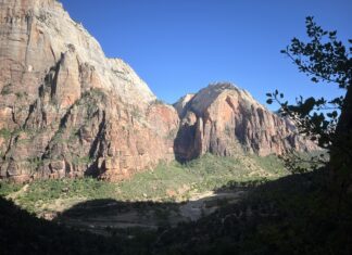 Distance Remains on Colorado River Basin Water Sharing Deal An elevated view of the rock formations of Zion National Park over the Virgin River running through the park.
