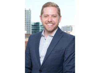 Alex Paalborg Rejoins Davis Graham & Stubbs as Of Counsel Alex Paalborg, in a blue suit jacket, smiles in a headshot photo.