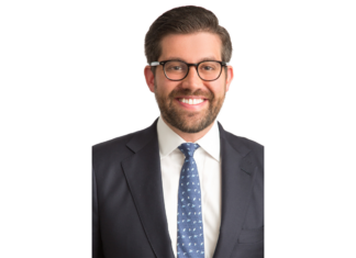 Littler Appoints David Gartenberg as Denver Office Managing Shareholder David Gartenberg smiles in a headshot photo wearing black glasses, a blue tie and a navy suit jacket.