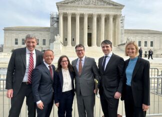 Only a Year in, Olson Grimsley Already Has Some Stories to Tell Eric Olson, Kenzo Kawanabe, Abigail Hinchcliff, Sean Grimsley, Jason Murray and Isabel Broer stand in front of the U.S. Supreme Court.