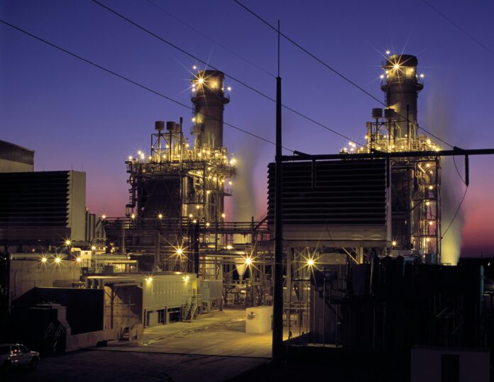 american-public-power-association-TF-DL_2L1JM-unsplash A natural gas power plant at night.
