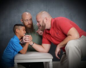 David Meyer, right, with his son and husband, Donny.