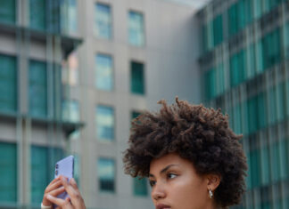 AI adds complexity to challenges with video evidence Woman using phone